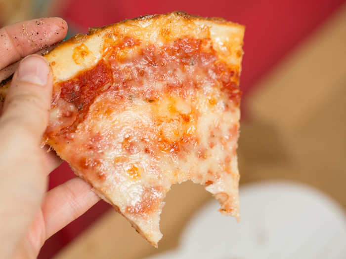 The crust lifts off the plate around the edges, making the slice easy to hold. But it