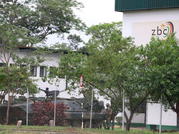 In addition to government offices, the army seized control of radio and television stations. An armored military vehicle was parked outside the state-run Zimbabwean Broadcasting Corporation building in Harare.