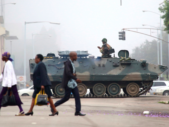 Tanks and soldiers were the backdrop to the city as people walked to work.