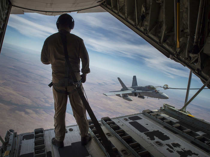 Marines also train to operate in the air. Here, a crew master observes an F/A-18C Hornet approach a refueling hose during Exercise Pitch Black 2016 at Royal Australian Air Force Base Tindal on August 9, 2016.