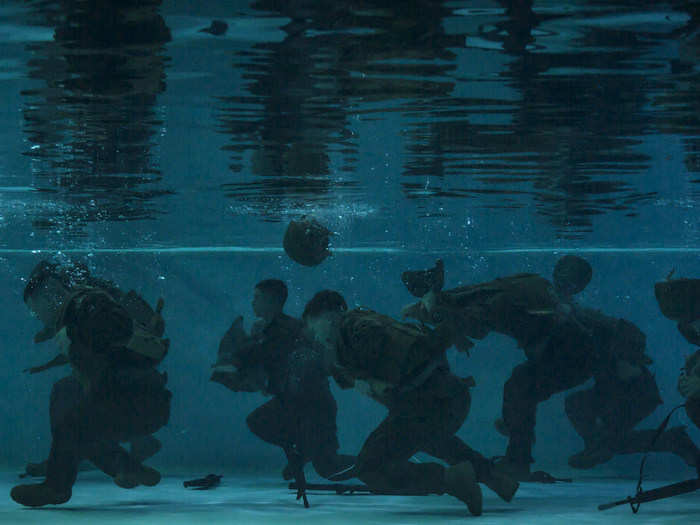 The Marine Corps also trains to fight and survive in water. Here, Marines conduct an underwater gear shed during a basic swim qualification course at Marine Corps Air Station Cherry Point, North Carolina, on March 16, 2016.