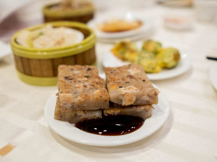 Though this dish is nominally called a “cake,” don’t expect the pan-fried turnip cake (lohr bahk go) to be dessert. The dense, starchy sweet turnip base is brightened by umami bombs of dried shrimp and Chinese sausage sprinkled through out.