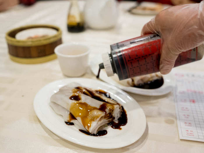 Next up, beef and shrimp noodle rolls (ngau cheung and har cheung). This dish features a barbecued or steamed filling stuffed in a sheet of rice noodle, then topped at the table with warm, sweetened soy sauce.