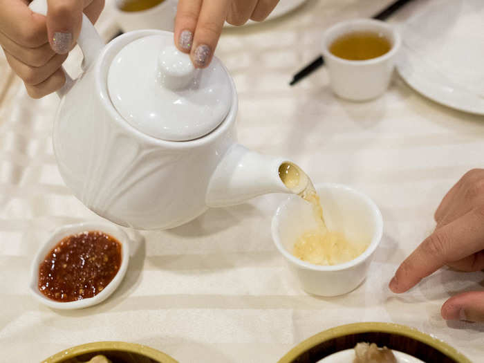 Rule of thumb: Pour tea for everyone else at the table before yourself. If someone is pouring for you, tap a bent index finger as a thank you. It symbolizes bowing.