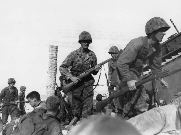 Marine assault waves were met with steadily increasing enemy fire. The amphibious tractors that took the Marines ashore had trouble with the seawall, leaving them stuck on the beach and vulnerable to pre-sighted Japanese fire