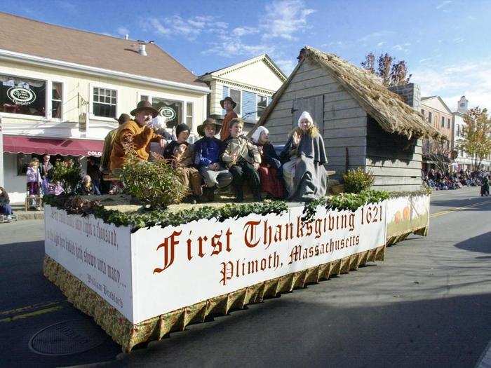 Musicians play bugles and drums, while vintage American cars and handmade floats ride through the streets.