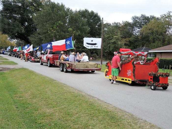 Texas flags wave on many of the floats.