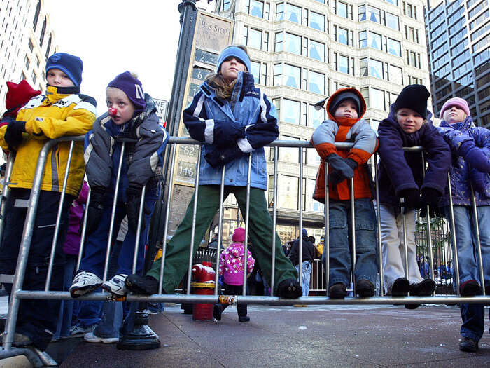 Thousands of people line the streets to watch.