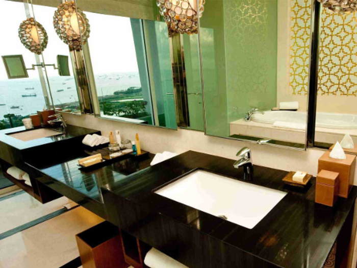 Even the bathrooms have panoramic ocean views at the Marina Bay Sands in Singapore.