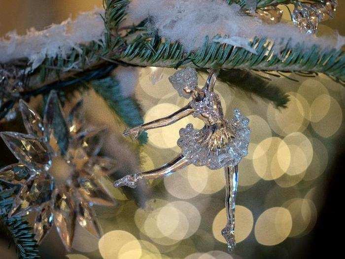 This amazing detail shows ornaments hanging on trees in the Grand Foyer and Cross Hall of the White House. The glass ballerina is a nod to "The Nutcracker Suite."