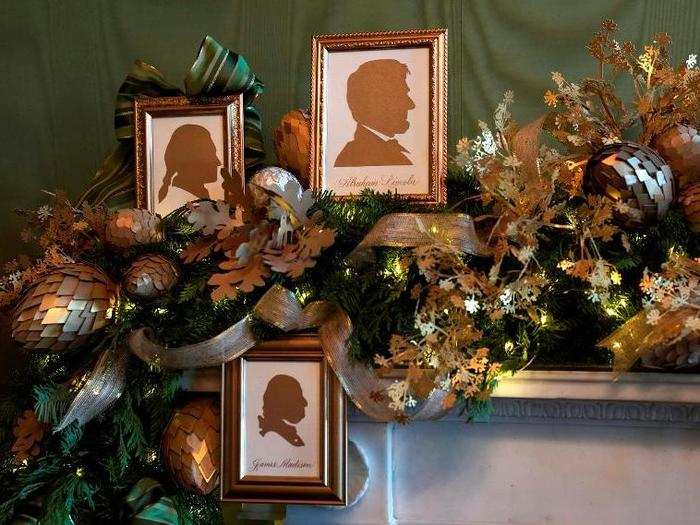 In the Green Room, silhouettes of past presidents appear in the garland above a fireplace.