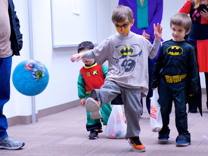 Kids dressed up for Halloween play games organized for the special occasion.