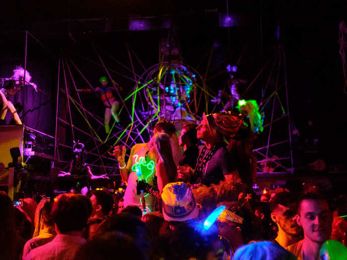 The main dance floor was sensory overload between the performers, the costumed partygoers, the blacklight, and the video art behind the stage.