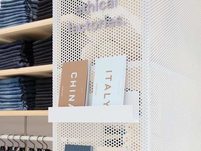 Everlane used granite, wood, and greenery on the interior of the store.