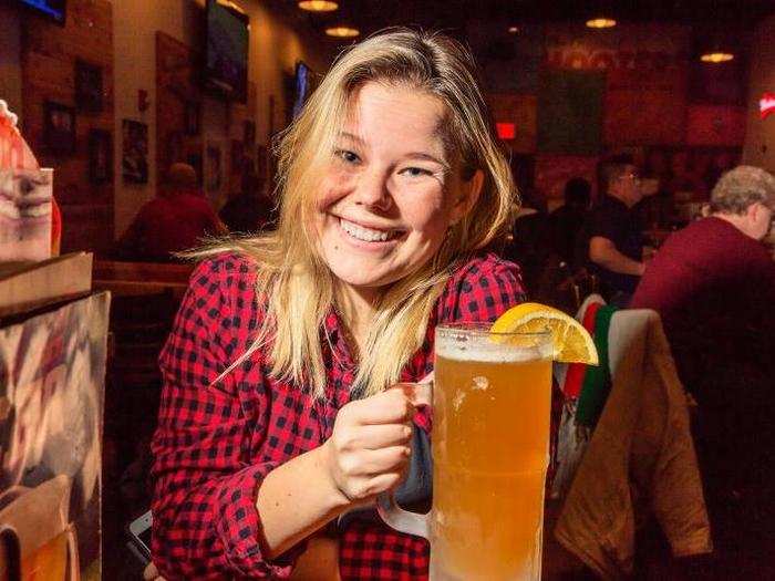 But, we were somewhat surprised to see the actual customers were far more diverse than the bro-fest we anticipated. Couples, women, and families were all eating wings together in harmony. Excited to witness such community, Kate ordered a "Big Daddy"-sized beer.