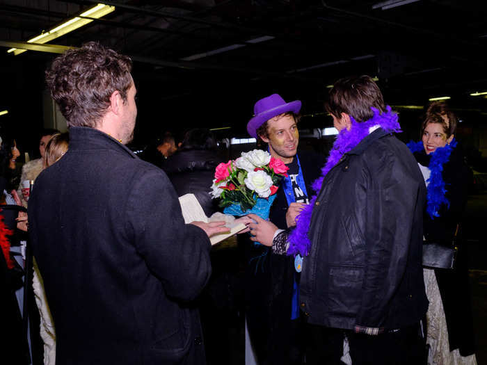 Other volunteers were walking up and down the line offering to perform "party marriages." The tongue-in-cheek vows included "Do you promise to share whatever drugs you smuggle onto the boat with your partner?"