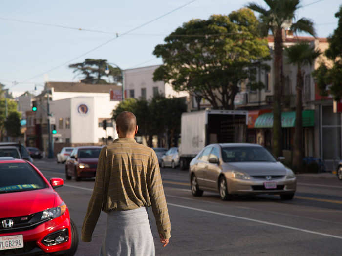 Standing out of sight of a Muni line, it