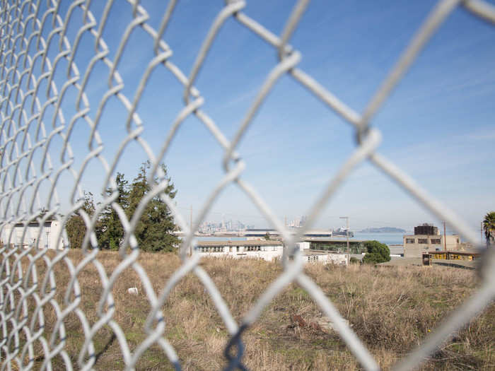 The city bus drops residents off along the back of the development, where rows of condominiums meet what remains of the retired San Francisco Naval Shipyard.