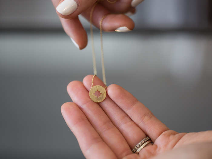 The "Going Places" compass necklace is another "hero SKU" for the brand. Agnew said the $80 price point makes it a desirable compromise between costume jewelry and solid gold.