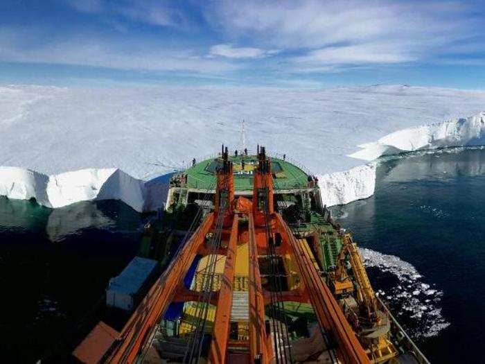 Russian research vessel Akademik Tryoshnikov rests its bow against the Mertz Glacier in Eastern Antarctica to deploy an underwater drone.