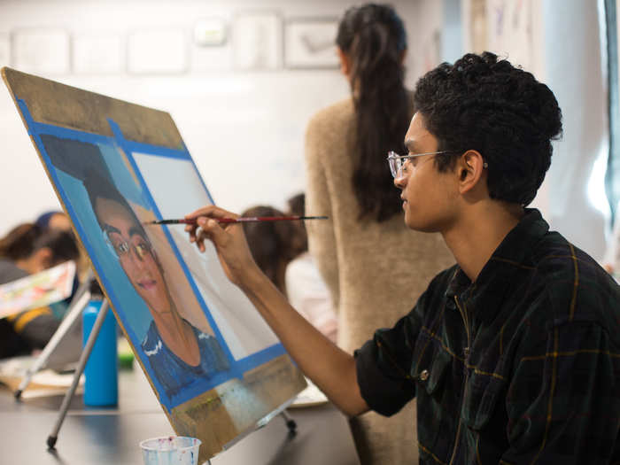 In the final few periods of the day, I dropped into classes focused on the liberal arts. A senior in the 2D painting class tapped into his creative side with a magnificent self-portrait.