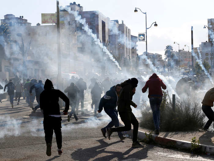 Protestors marching near Ramallah were met with tear gas and rubber bullets fired by Israeli soldiers. In response, Palestinians threw rocks and burned tires.