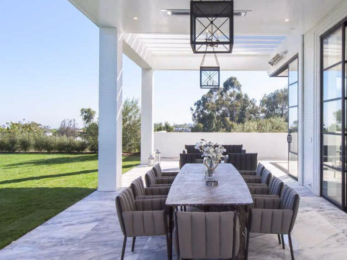 If the guys want to hang outside on a warm Los Angeles summer evening, they can take their drinks from the bar to the luxurious outdoor patio. Like much of the house, the patio floor is made of marble.