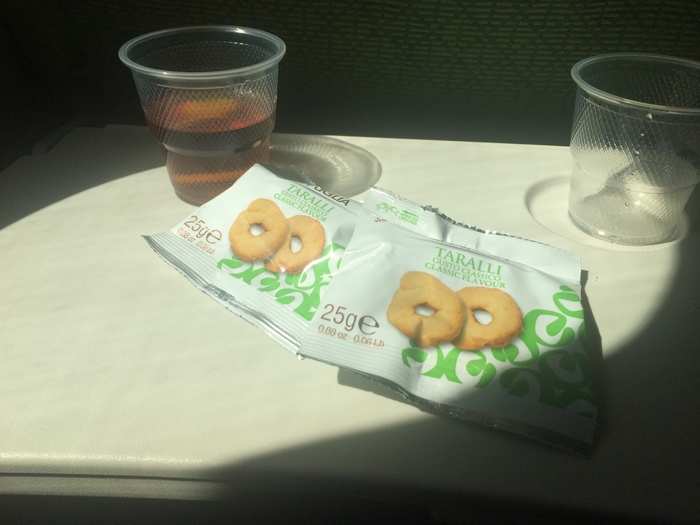 Still, I wanted to see what other snacks were available. The flight attendant brought me these Italian crackers which were coated in salt and olive oil. They certainly beat peanuts and pretzels. And they paired nicely with apple juice.