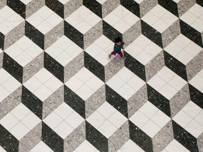 A boy walks at a shopping mall in Tokyo, Japan.