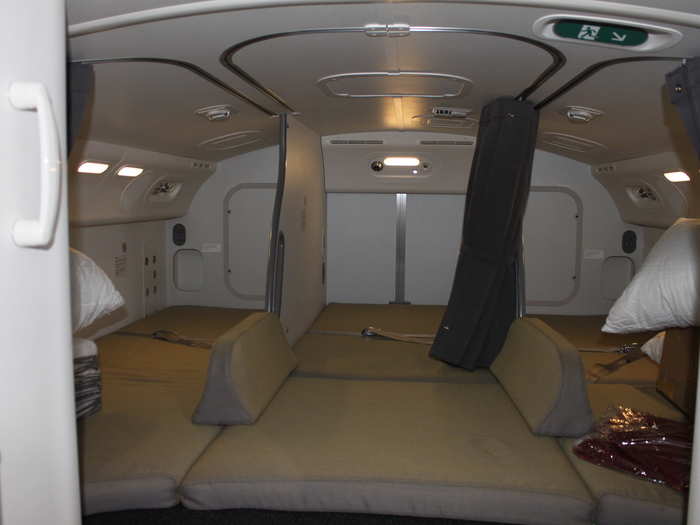 At the back of the compartment are three forward-facing facing beds.