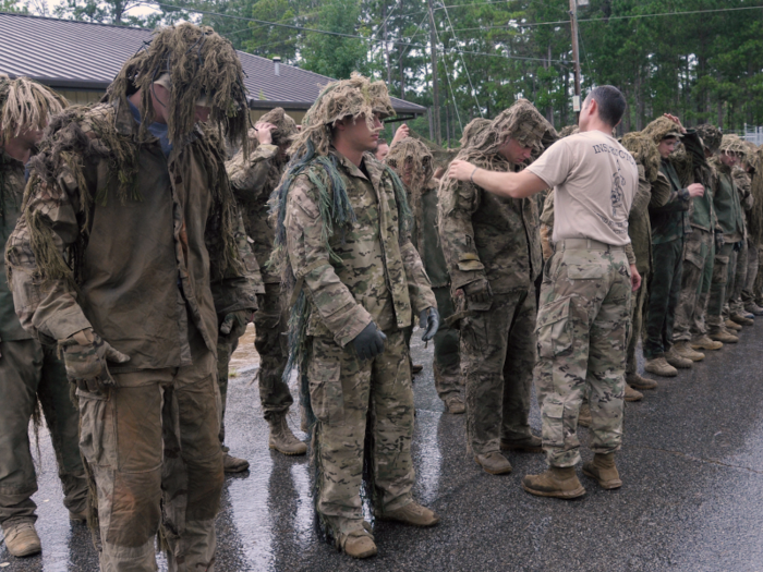 After a battery of physical-fitness tests on the first day, candidates are taught to make a ghillie suit — a camouflage suit that uses foliage to break up the outline of the soldier