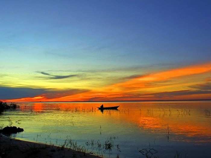 Wade into the water of Alter do Chao, Brazil.