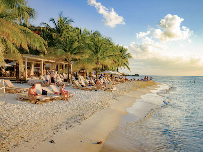 Take in the surf in Roatán, Honduras.