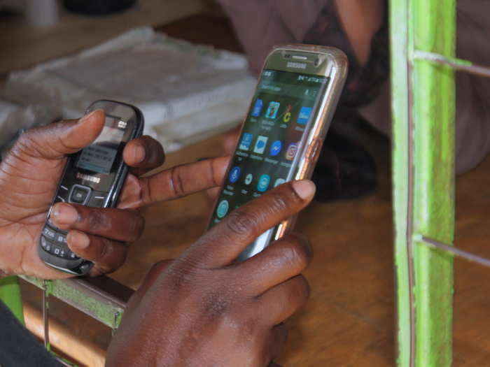 The system is straightforward: Teti (the user) opens her app, enters the "agent number" tied to that particular kiosk, and keys in the amount she