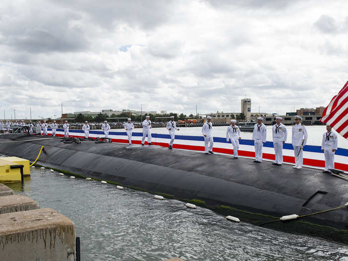 Sailors bring the USS Washington to life during the commissioning ceremony for the Virginia-class attack submarine at Naval Station Norfolk on October 7.