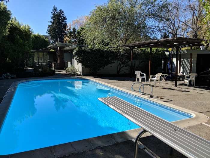 Out the back is large patio and a pool — which Zuckerberg and co. once built a zipline to, destroying the chimney in the process. The landlords have explicitly forbidden residents from trying to recreate it.