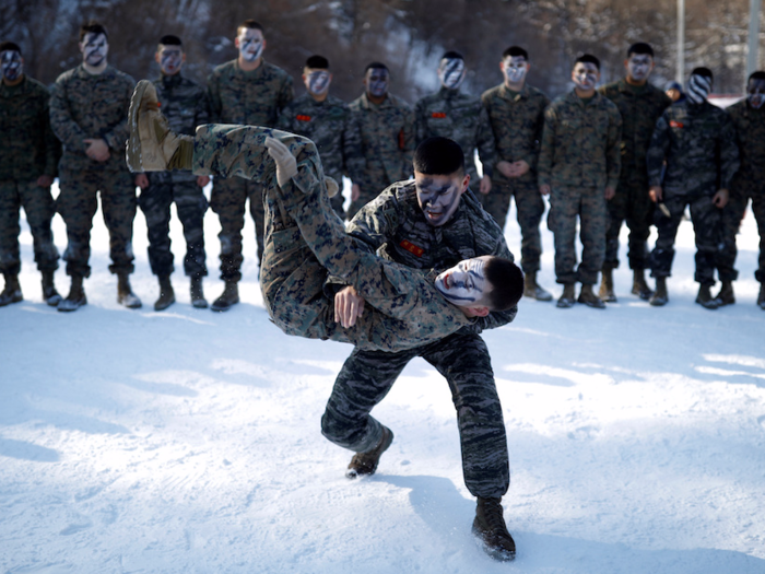 Both sides demonstrated hand-to-hand tactics. Here a South Korean Marine teaches a US Marine a new technique.