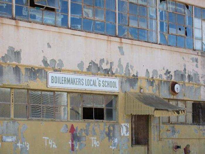 Buildings that once contained barracks, schools, a cafeteria, and other non-industrial facilities were emptied and left to rot. Paint now chips away like fingernail polish.