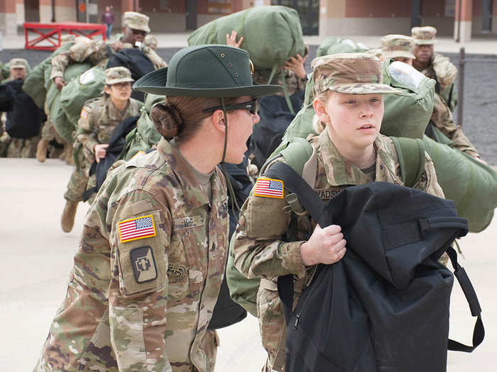 A US Army drill sergeant corrects a recruit during her first day of training at Fort Leonard Wood on January 31.