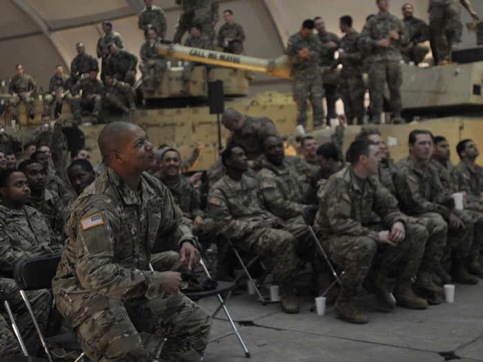 Soldiers with 3rd Armored Brigade Combat Team, 4th Infantry Division, watch the Super Bowl in Karliki, Poland on February 5.