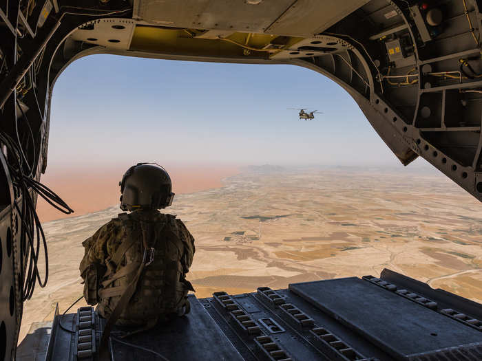 A CH-47 Chinook helicopter pilot deployed with Task Force Warhawk scans below over the Registan Desert in Helmand Province, Afghanistan on June 21.