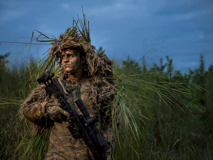 A US Army Reserve sniper and infantryman poses at Joint Base McGuire-Dix-Lakehurst in New Jersey on July 26.