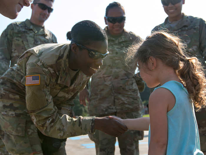 Sgt. Samiera Lanier is greeted by a young child after arriving at Liberty Fire Department in Texas on September 2 after Hurricane Harvey.