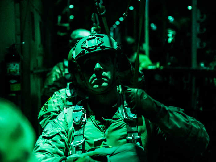 A US Army Green Beret stands ready to exit a C-130 Hercules aircraft during a night jump on October 24 at Fort Carson, Colo.