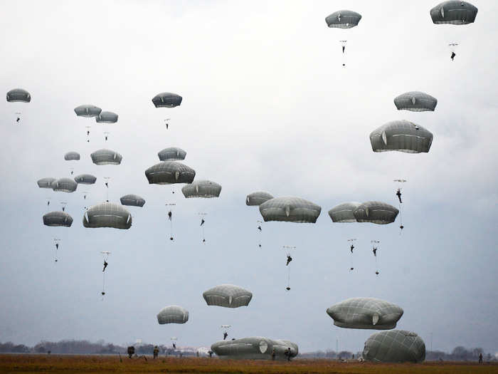 US Army Paratroopers conduct an airborne operation from a C-130 Hercules in Pordenone, Italy on December 12.