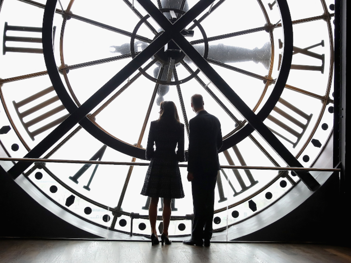 The next day, she and William were in Paris, and enjoyed a quiet moment looking out over Paris from behind the clock face of the city