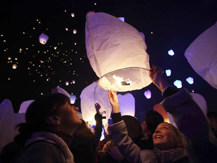 In Croatia, residents release thousands of paper lanterns carrying their Christmas hopes and wishes into the sky at the nation