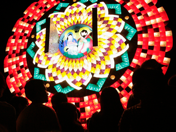 A festival in San Fernando, the "Christmas capital of the Philippines," attracts spectators to see the massive, geometric-patterned lanterns that shine brightly.