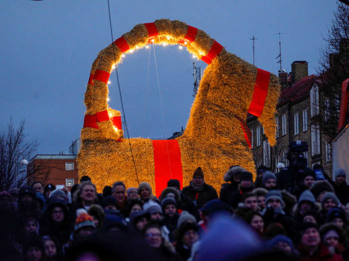 A goat made of straw — a reminder that Jesus was born in a manger — guards the Christmas tree in some Swedish homes. The city of Gävle builds this display every year.