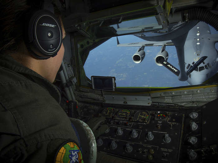 Senior Airman Jacqueline D’urso, a boom operator with the 91st Air Refueling Squadron, prepares to make contact with a C-17 Globemaster III aircraft during a refuel mission over the southeast US on April 4.